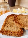 Breakfast with integral toast, butter and apricot jam on wooden table Royalty Free Stock Photo