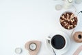 Breakfast for lovers on February 14. A Cup of Coffee and chocolate-cereal balls on a white background with candles and Royalty Free Stock Photo