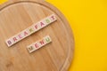 Breakfast Menu Concept. Scrabble Letter Tiles On Wooden Table. Yellow Background