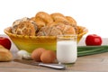 Breakfast menu - fresh buns, milk, eggs and tomatoes Royalty Free Stock Photo