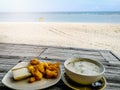 Breakfast on the morning beach table and sunrise Royalty Free Stock Photo