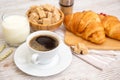 Breakfast in the morning with black coffee cup with bread with Croissant and fruit on the wooden table Royalty Free Stock Photo