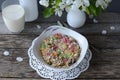 Breakfast: muesli with a glass of milk and a bouquet of blooming apple tree branches Royalty Free Stock Photo