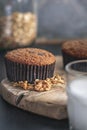 Breakfast muffin with milk and muesli on the side