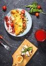 Breakfast mushrooms omelet and sandwich with figs on stone background. Top view.