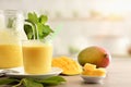 Breakfast with natural mango juice with milk in kitchen Royalty Free Stock Photo