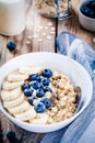 Breakfast: oatmeal with bananas, blueberries, chia seeds and almonds Royalty Free Stock Photo