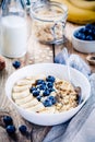 Breakfast: oatmeal with bananas, blueberries, chia seeds and almonds Royalty Free Stock Photo