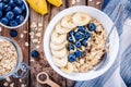 Breakfast: oatmeal with bananas, blueberries, chia seeds and almonds Royalty Free Stock Photo