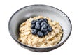 Breakfast oatmeal with blueberries and almonds. Isolated on white background. Top view. Royalty Free Stock Photo