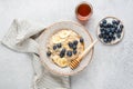 Breakfast oatmeal bowl with blueberries, banana, coconut and honey