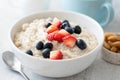 Breakfast oatmeal porridge with strawberry, blueberry