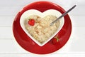 Breakfast of Oatmeal or Porridge in a heart bowl with strawberry Royalty Free Stock Photo