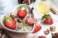 Breakfast with oatmeal with strawberries and egg