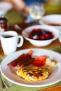 Breakfast with omelet, fresh fruits and coffee