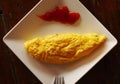 Breakfast omlette close up photo on square plate with fork Royalty Free Stock Photo