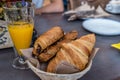 Breakfast with orange juice and croissants with chocolate