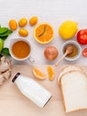 Breakfast with orange juice, oranges, oranges slice, passion fruit , ginger,tomato and Kiwi set up on wooden table . Royalty Free Stock Photo