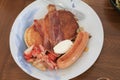 Breakfast pancakes bacon and sausages on wooden table. Homemade Continental breakfast at home kitchen Royalty Free Stock Photo