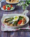 Breakfast of pancakes baked with asparagus with boiled egg and cream cheese Royalty Free Stock Photo