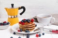 Breakfast with pancakes, berries and coffee