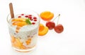 Breakfast parfait made from Greek yogurt with raspberry, peach, red currant, cherry and chia on a white backgrounds