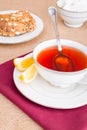 Breakfast with pastries, and hot tea with lemon. Royalty Free Stock Photo