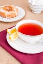 Breakfast with pastries, and hot tea with lemon. Royalty Free Stock Photo