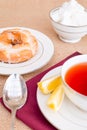 Breakfast with pastries, and hot tea with lemon. Royalty Free Stock Photo