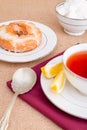 Breakfast with pastries, and hot tea with lemon. Royalty Free Stock Photo