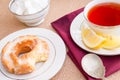 Breakfast with pastries, and hot tea with lemon. Royalty Free Stock Photo