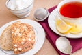 Breakfast with pastries, and hot tea with lemon. Royalty Free Stock Photo