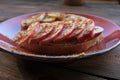 Breakfast with Peanut butter banana apple cinnamon sandwiches on wooden table. Slices of bread with peanut paste and fresh fruits Royalty Free Stock Photo