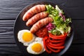 Breakfast Pigs in blankets fried sausages wrapped in bacon, eggs Royalty Free Stock Photo