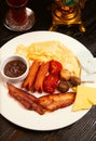 Breakfast plate with crepe, jam, fried sausages. Royalty Free Stock Photo