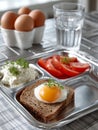 Breakfast plate with eggs, toast, tomatoes, and cottage cheese. Royalty Free Stock Photo