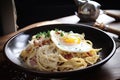 breakfast plate, filled with piping hot carbonara and fried eggs Royalty Free Stock Photo