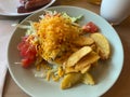 A breakfast plate of Japanese style taco rice and potato wedges Royalty Free Stock Photo