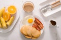 Breakfast plate with pancakes, eggs, bacon and fruit. Royalty Free Stock Photo