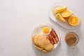 Breakfast plate with pancakes, eggs, bacon and fruit. Royalty Free Stock Photo