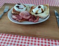 Breakfast on a plate using chopping board as a tray. Royalty Free Stock Photo