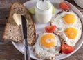 Breakfast plate with rye bread, butter, homemade apple yogurt and fried eggs, Royalty Free Stock Photo