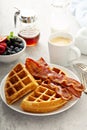 Breakfast plate with waffles and bacon