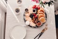 Breakfast platter. Table setting. Pancakes, breakfast sausages, berries, fruits, chocolate spread and coffee. Morning light. White Royalty Free Stock Photo