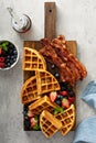 Breakfast platter with waffles, berries and bacon Royalty Free Stock Photo