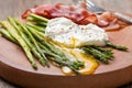 Breakfast: poached egg, baked asparagus Royalty Free Stock Photo