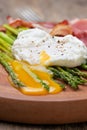 Breakfast: poached egg, baked asparagus Royalty Free Stock Photo