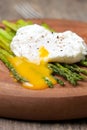 Breakfast: poached egg, baked asparagus Royalty Free Stock Photo