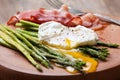 Breakfast: poached egg, baked asparagus Royalty Free Stock Photo