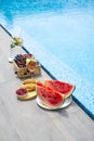 Breakfast by the pool. Watermelon, berries, croissants, non-alcoholic cocktails by the pool.